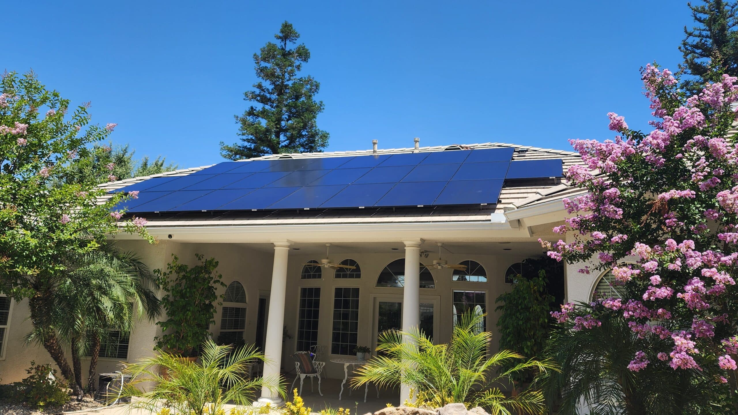 A finished BSW solar array on a tile roof under a clear Bakersfield sky