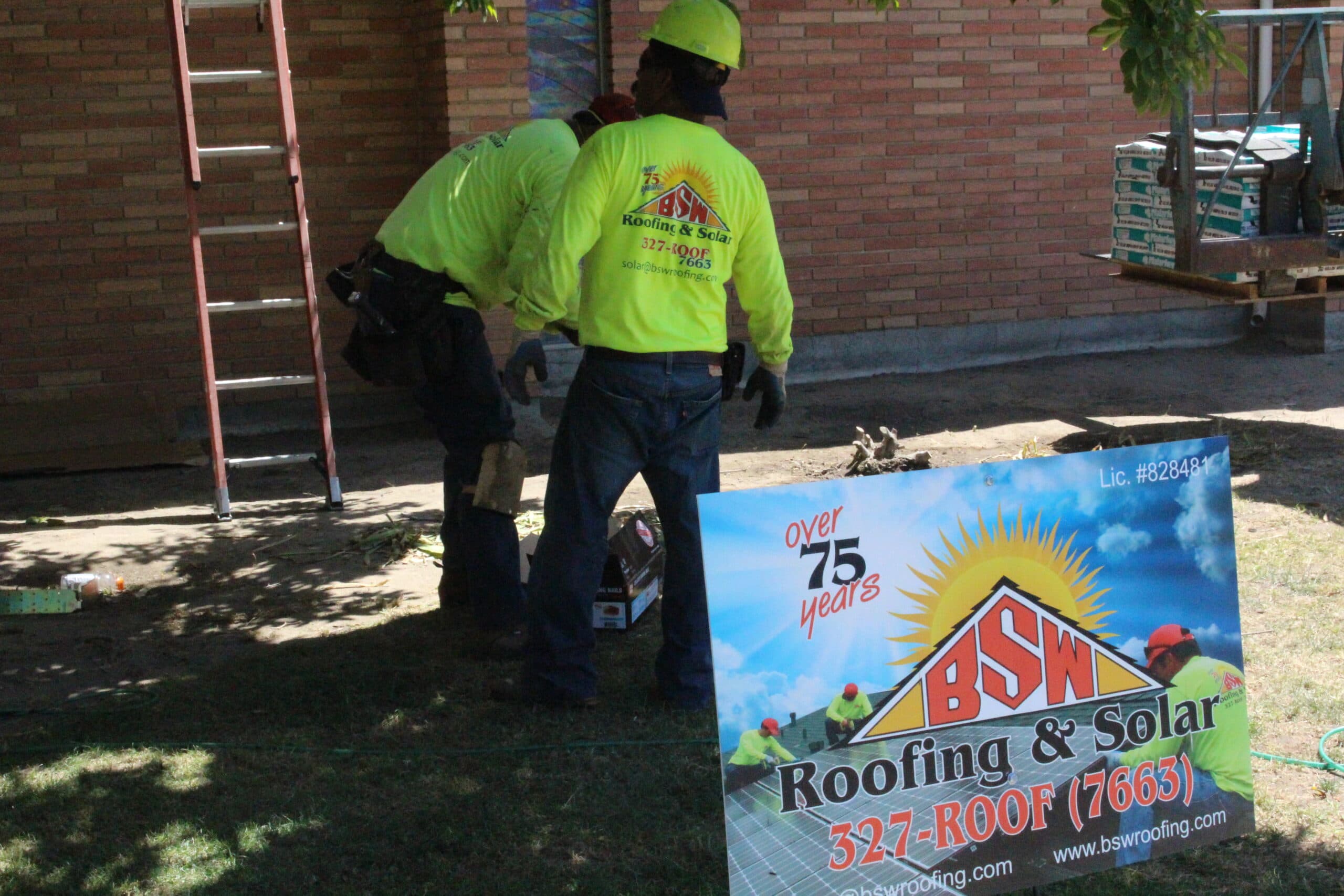BSW crew beside the company sign at a job site