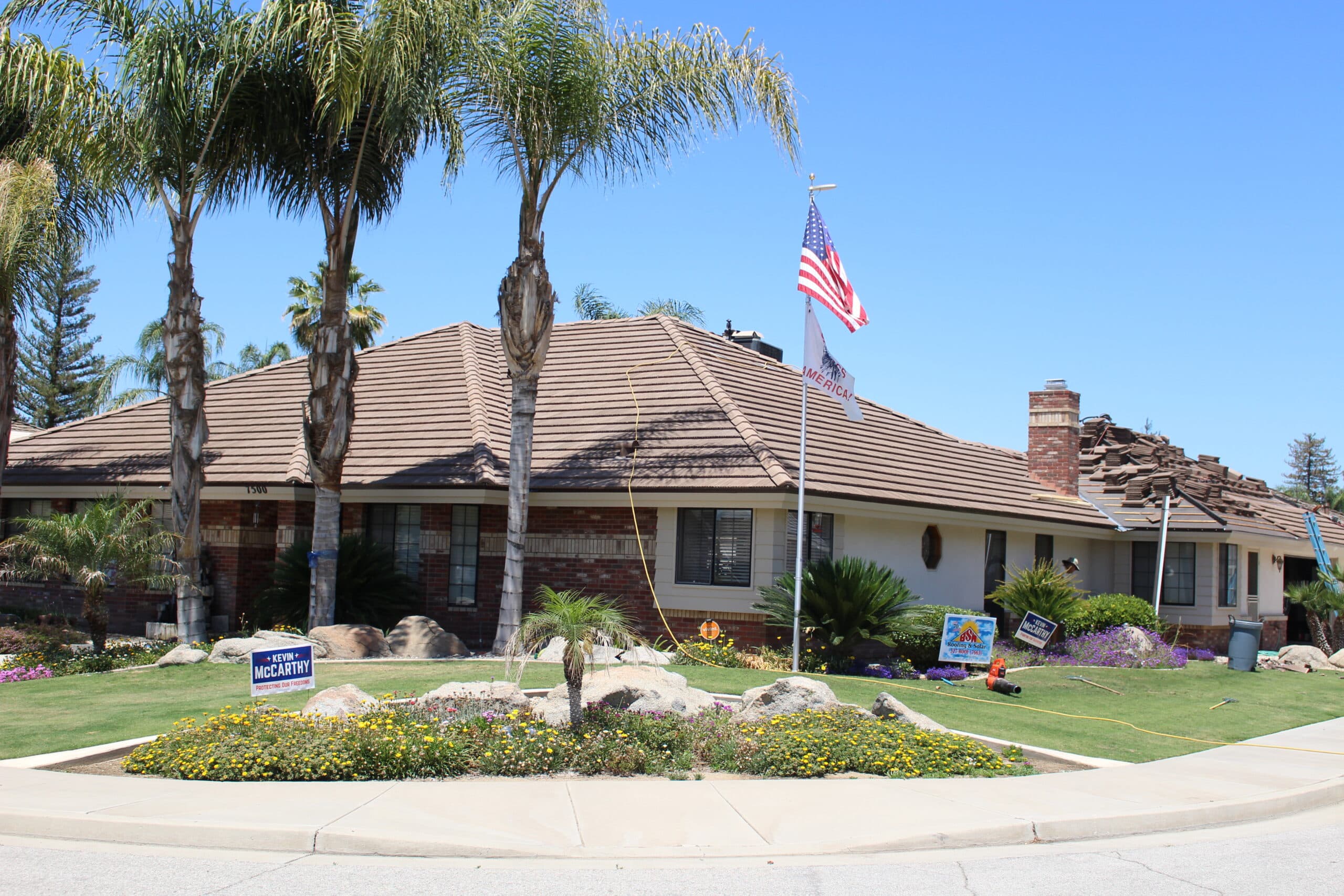 Tile re-roof in progress on a valley home