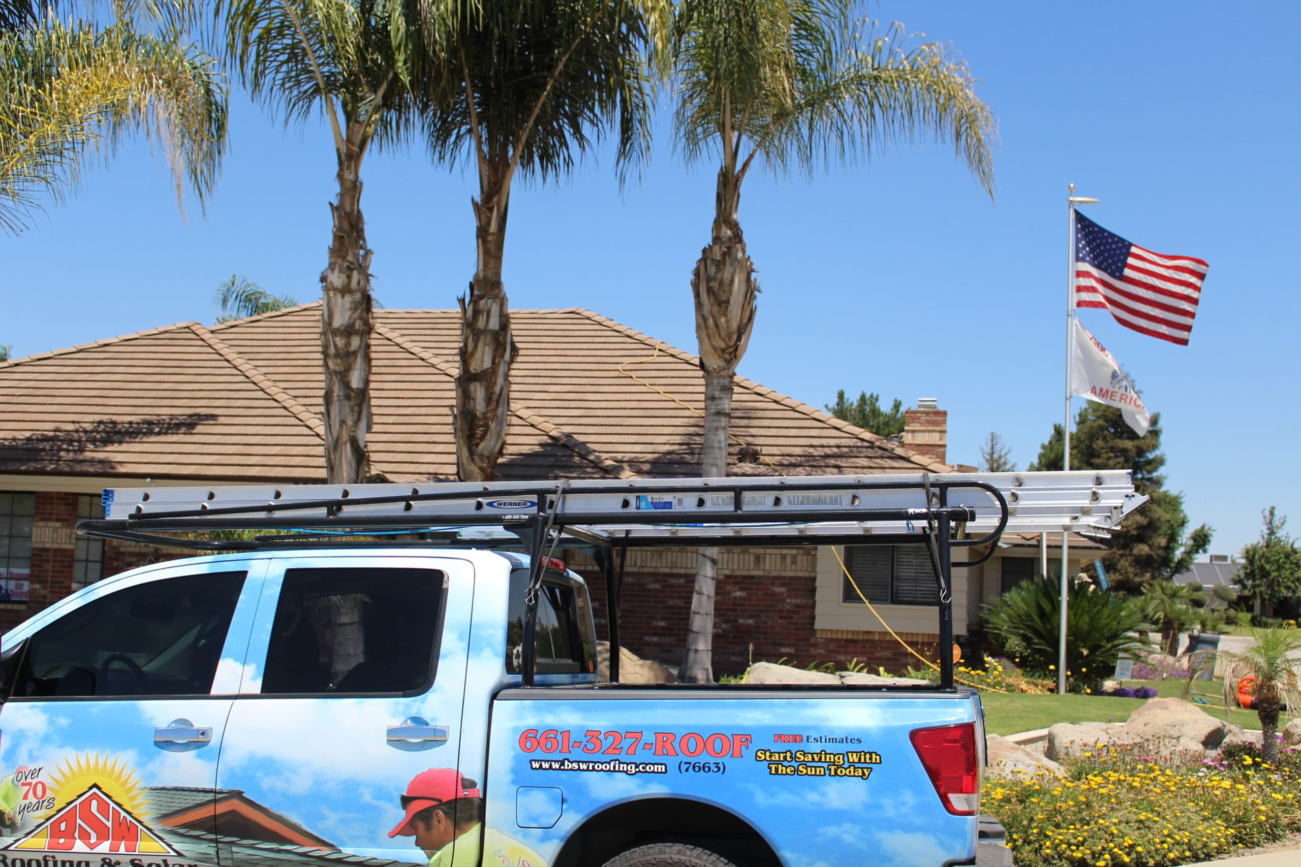 A BSW truck loaded with ladders outside a Bakersfield home