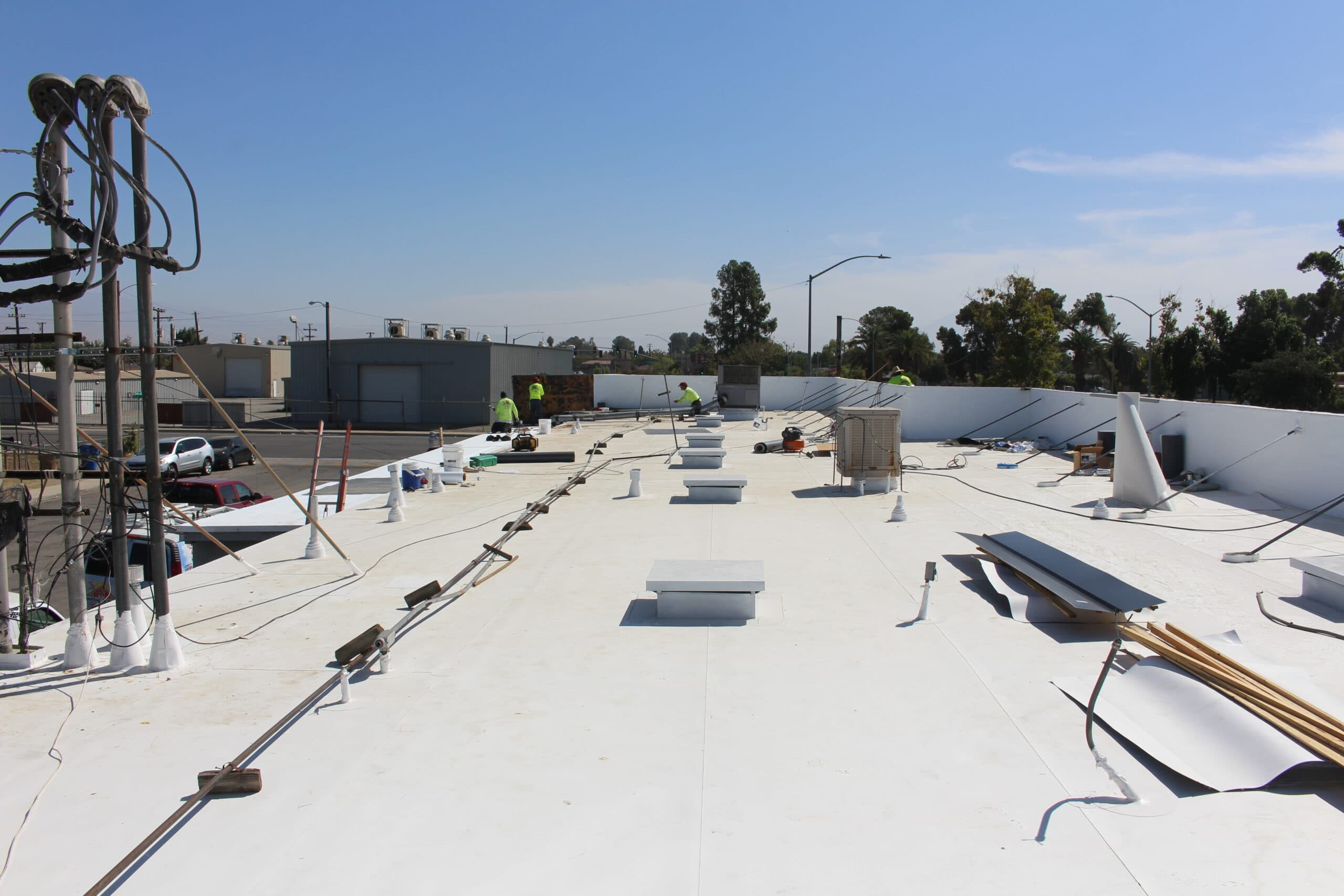 BSW crew welding a white TPO membrane
